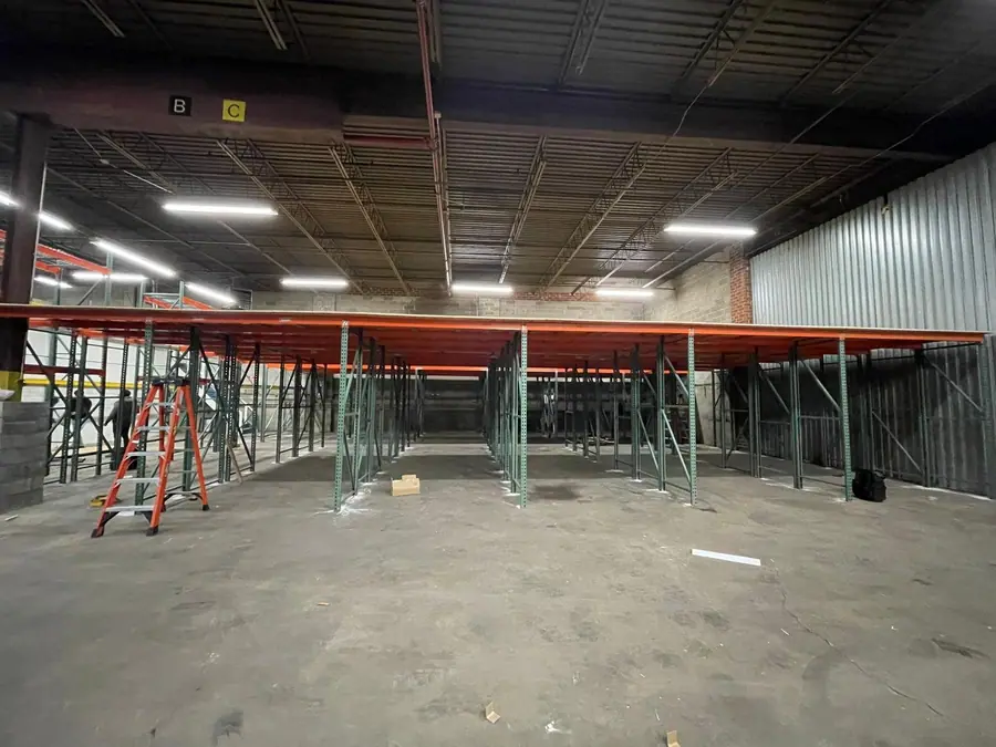 Rows of pallet racking orange beams