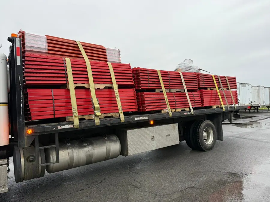 Rack beam delivery on flatbed truck