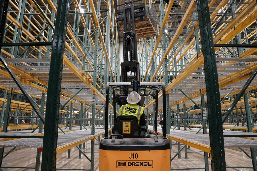 Narrow aisle forklift in racking